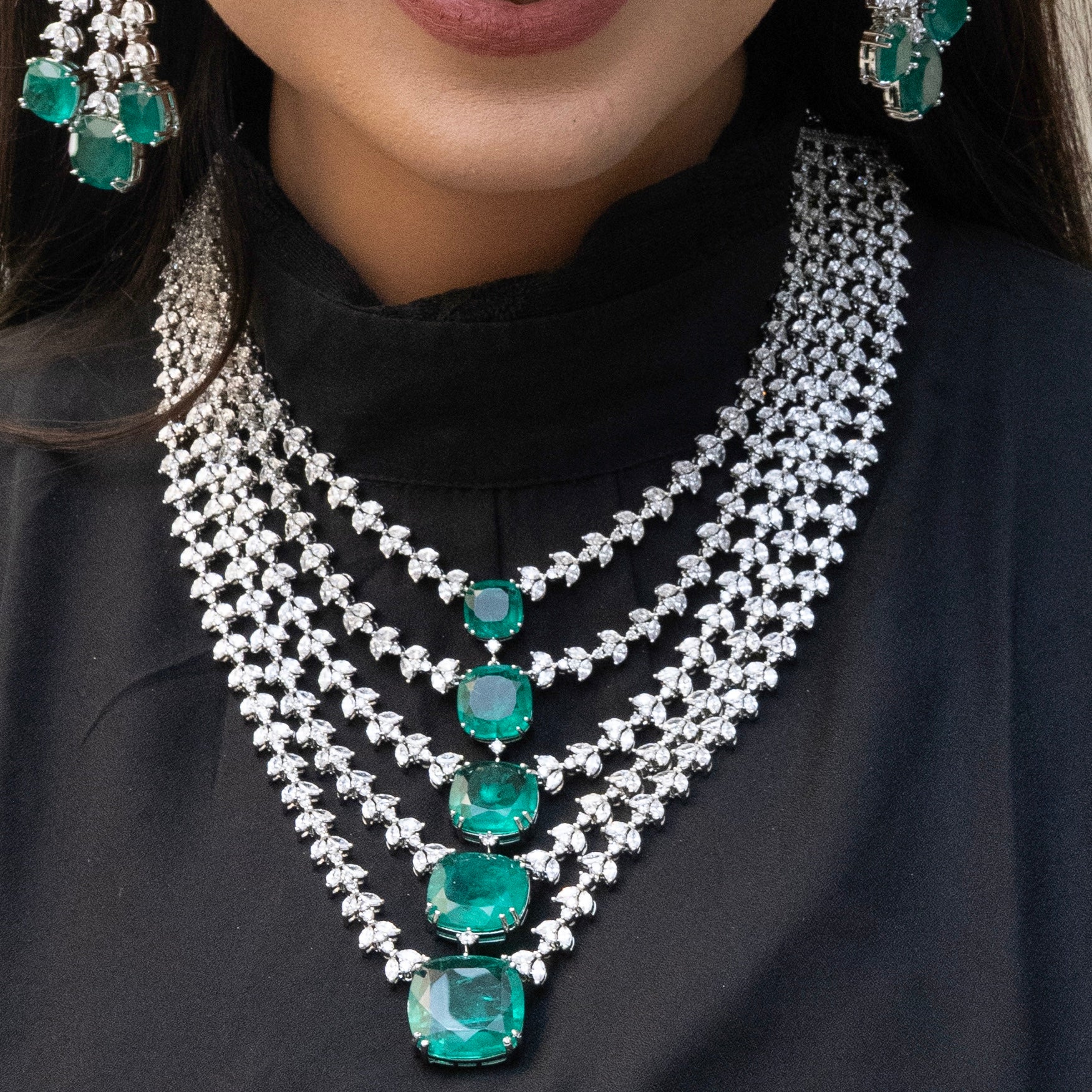 5-layered emerald and diamond necklace with bold design and radiant green stones